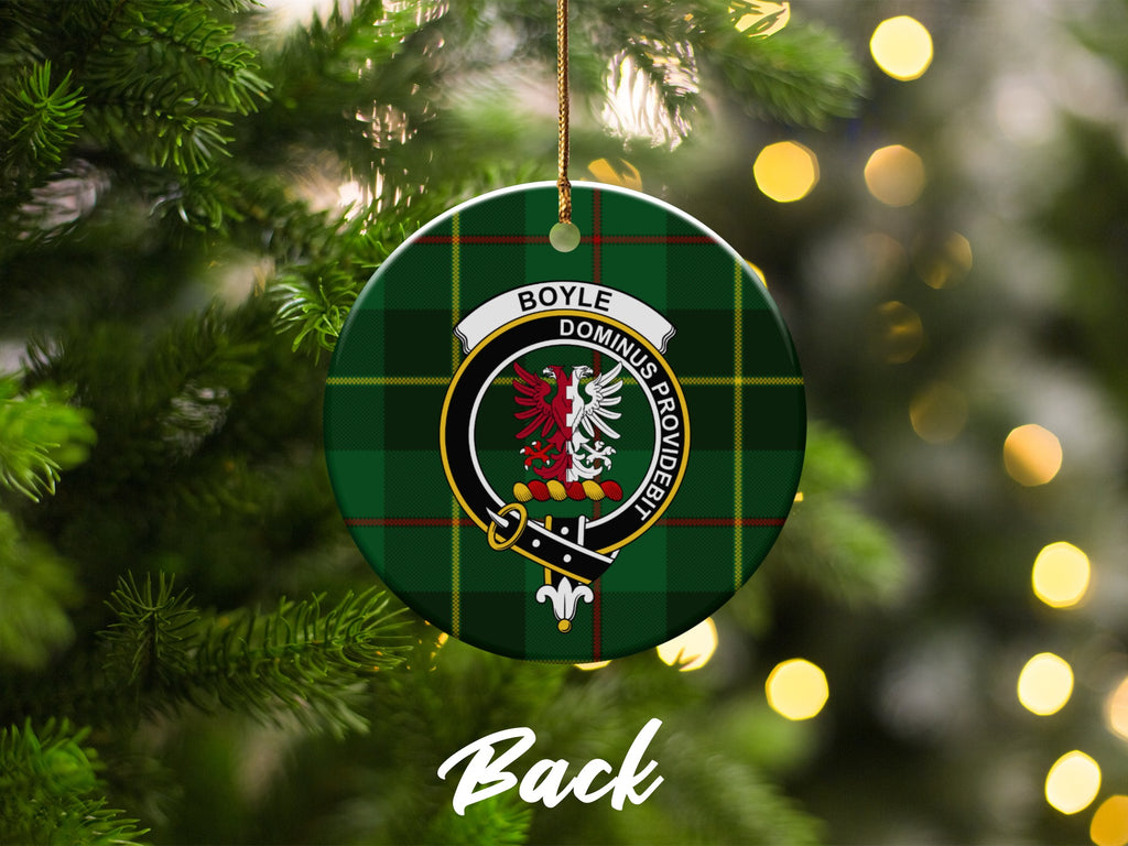 Boyle family crest on round tartan ornament hanging on a decorated tree