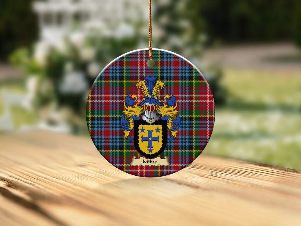 Round Milne Scottish clan ornament with family crest on a Caledonia tartan background