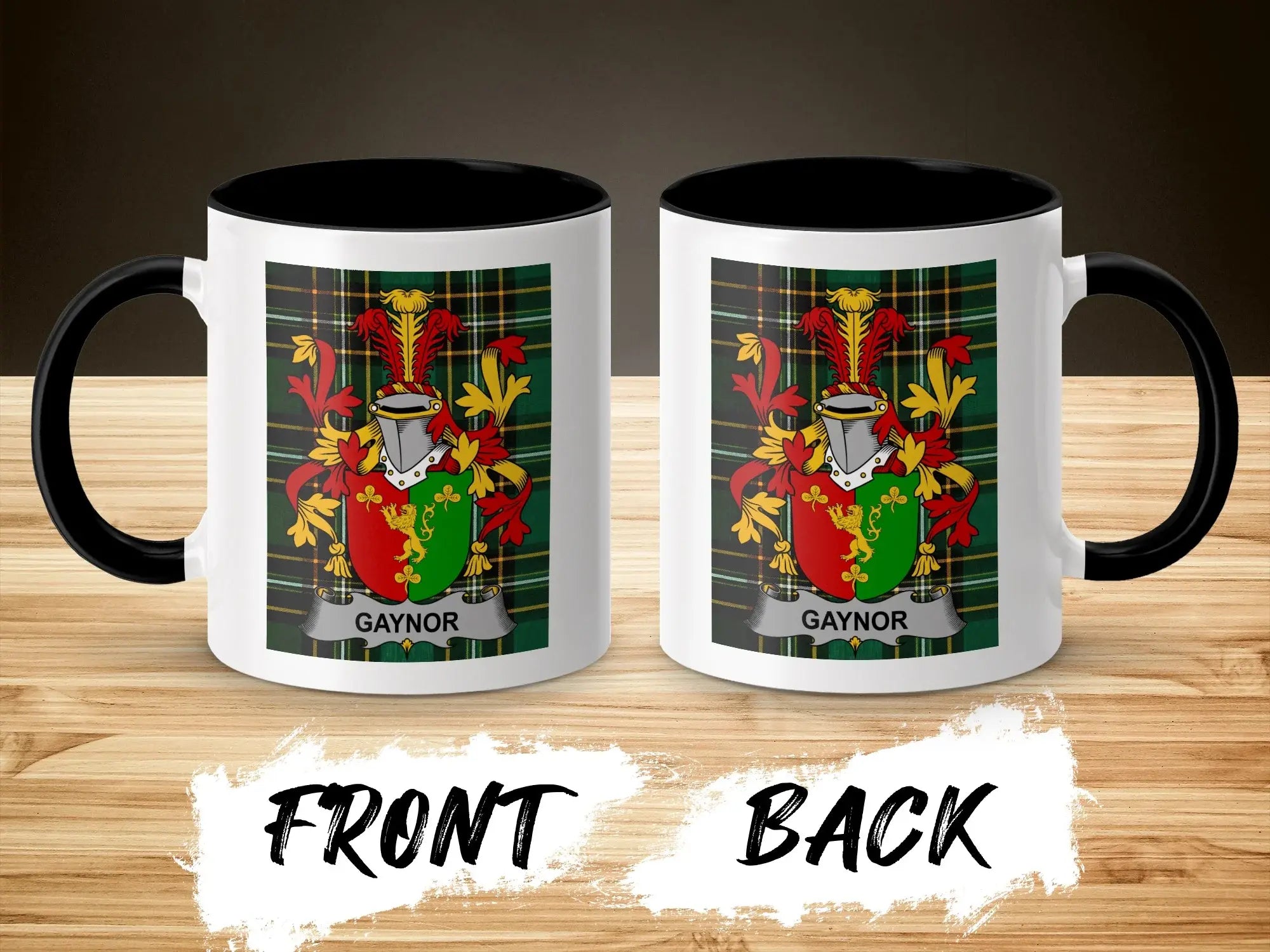 Two mugs with the Gaynor family crest on a wooden surface.