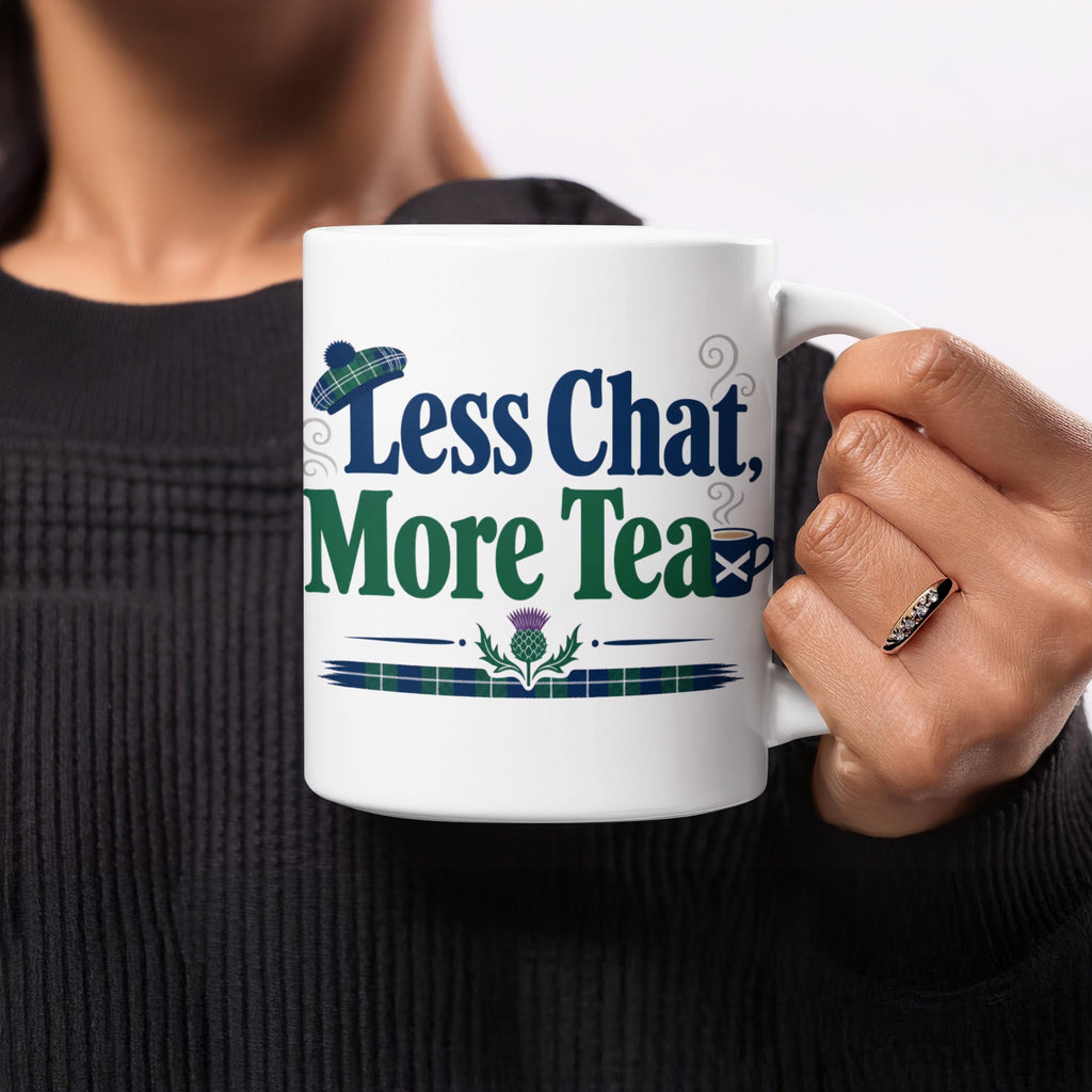 White mug with "Less Chat, More Tea" text and Scottish thistle design.