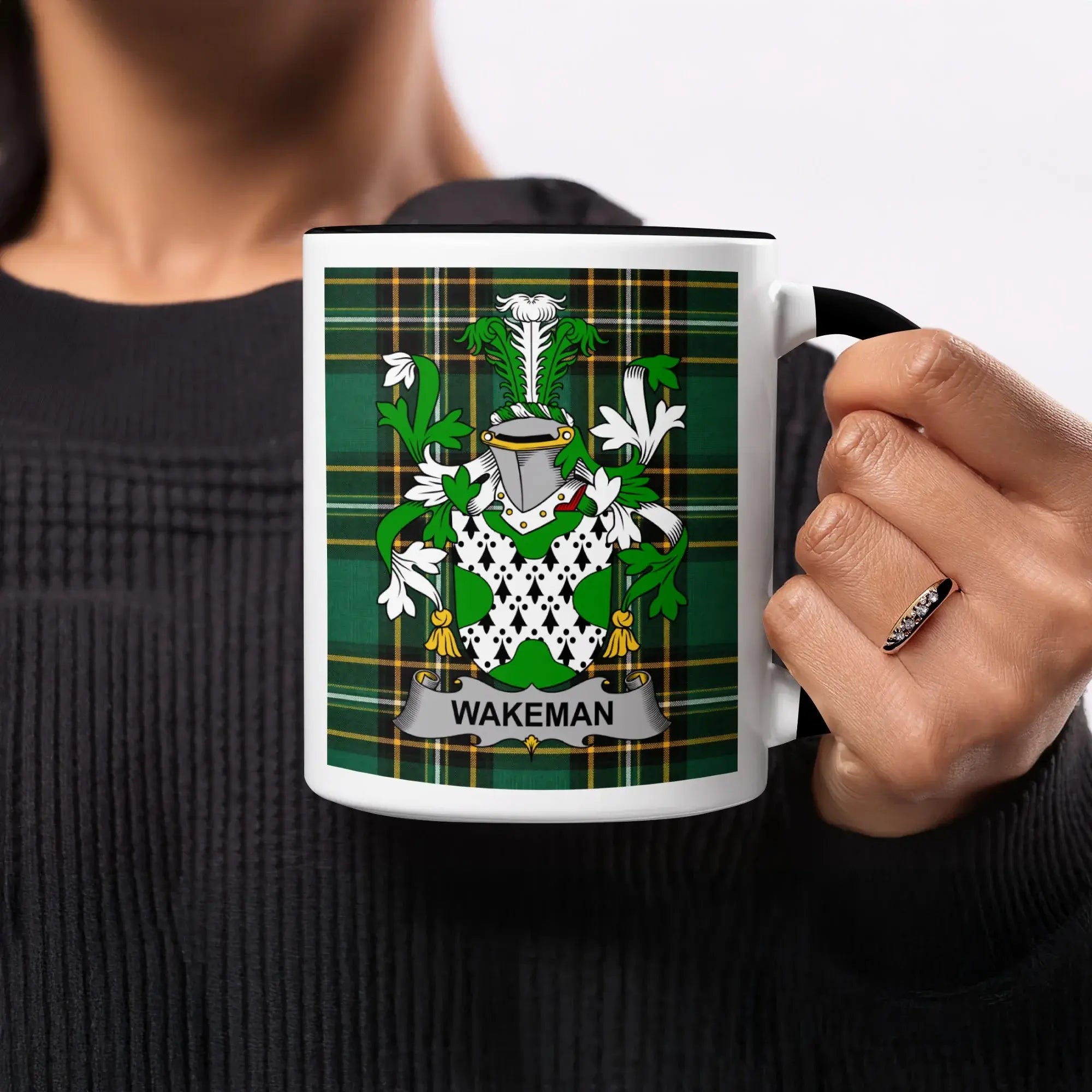Mug with Wakeman family crest on a green tartan background.