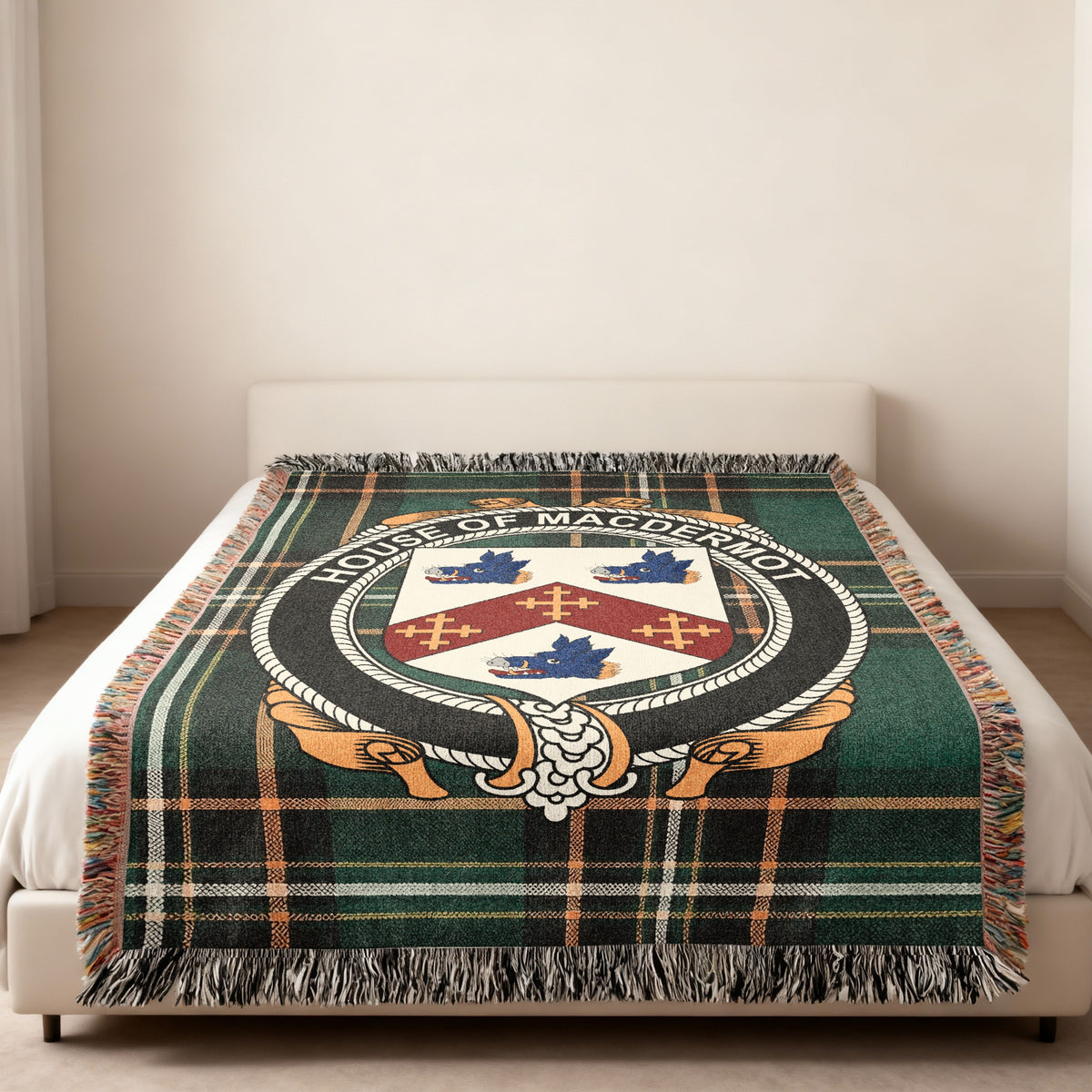 MacDermot family crest emblem woven blanket displayed on a bed