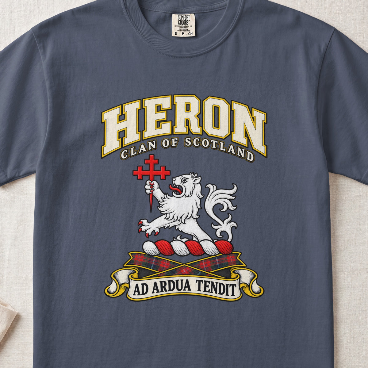Heron Scottish clan T-shirt in Midnight, front view with a white lion holding a red cross and motto banner.