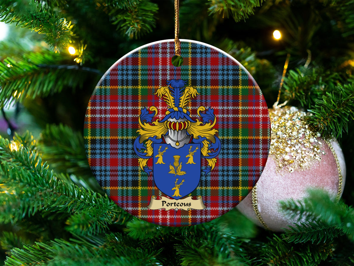 Porteous Scottish clan ceramic ornament with family crest on a Caledonia tartan background, hanging on a Christmas tree