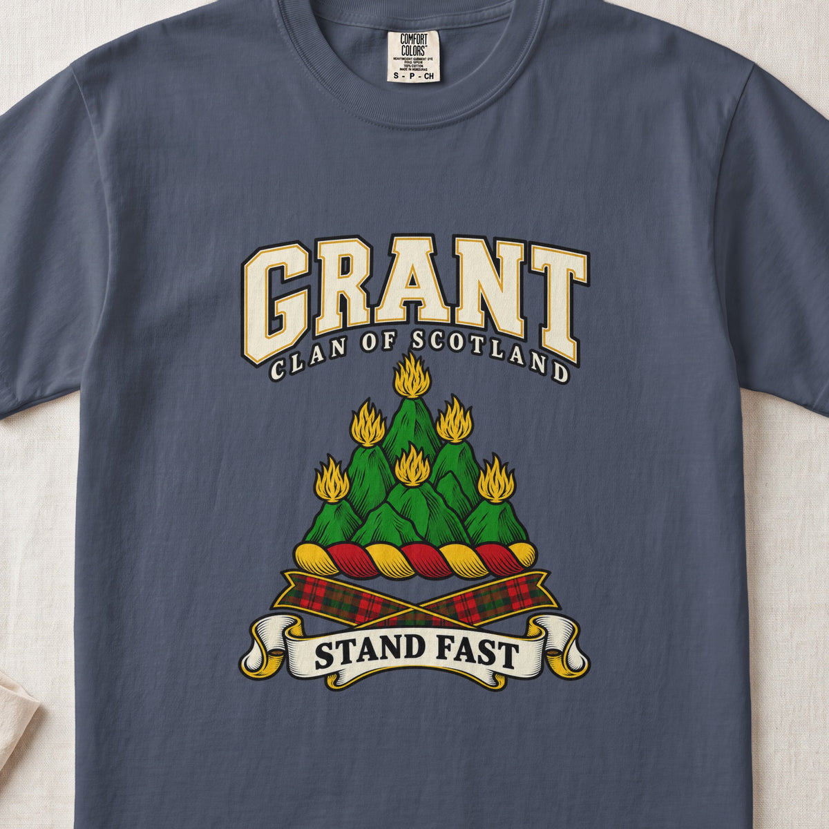 Grant graphic T-shirt in Midnight blue, front flat lay showing varsity lettering and green mountain-like mound with yellow flames.