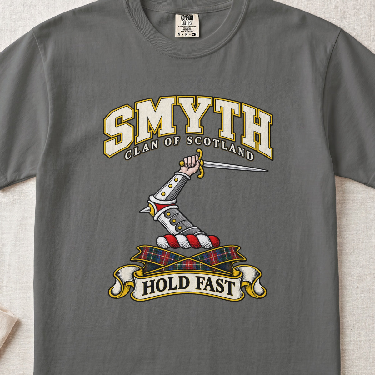 Smyth Scottish clan T-shirt in Pepper, front view with an armoured arm holding a dagger and motto design.