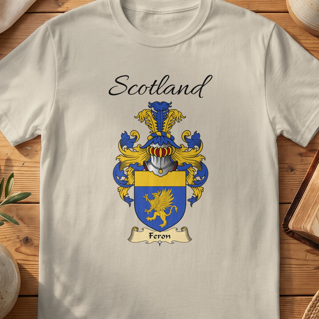 Sand Feron Scottish family shield T-shirt featuring a gold winged creature on blue