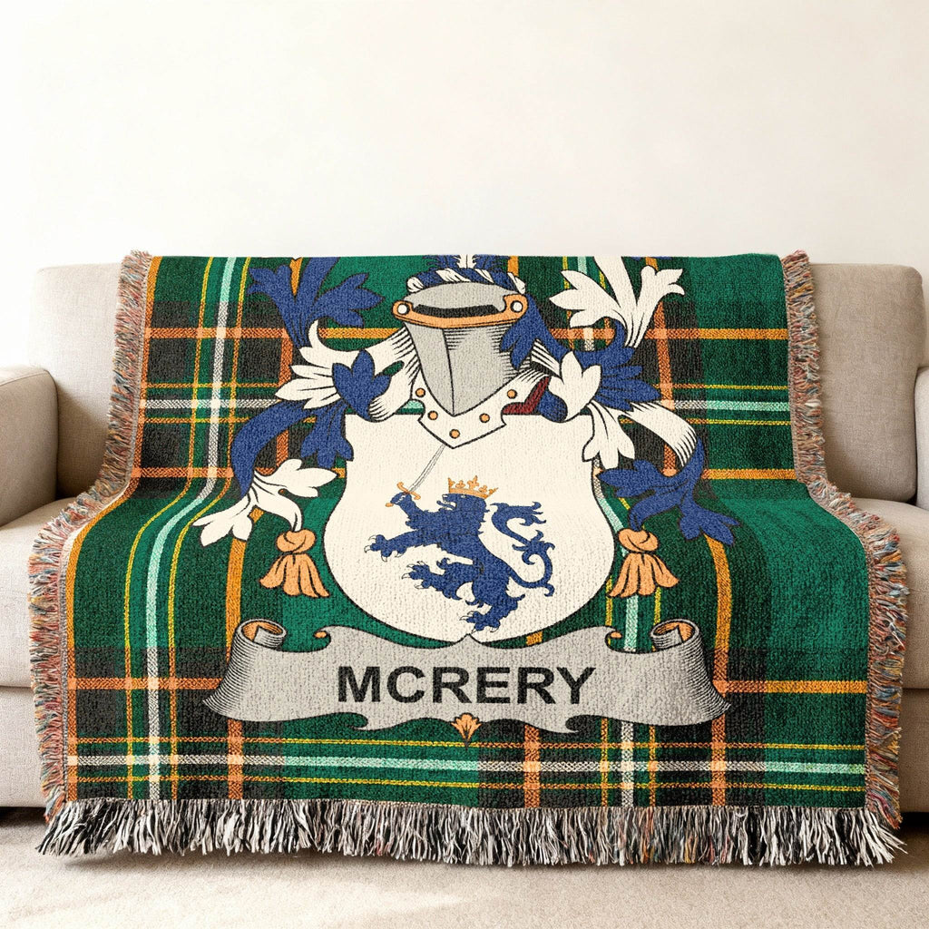 Green plaid throw blanket with McRery family crest.