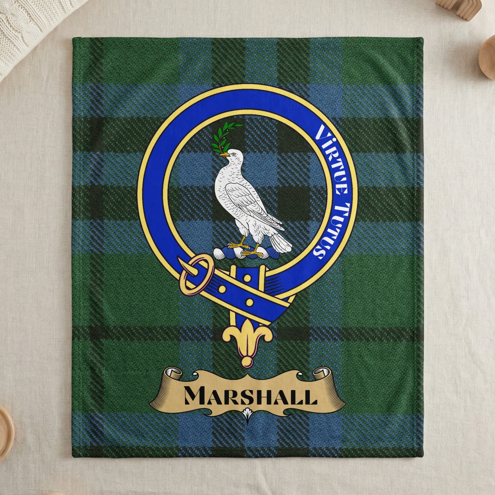 Marshall clan tartan throw blanket with crest and motto — draped display