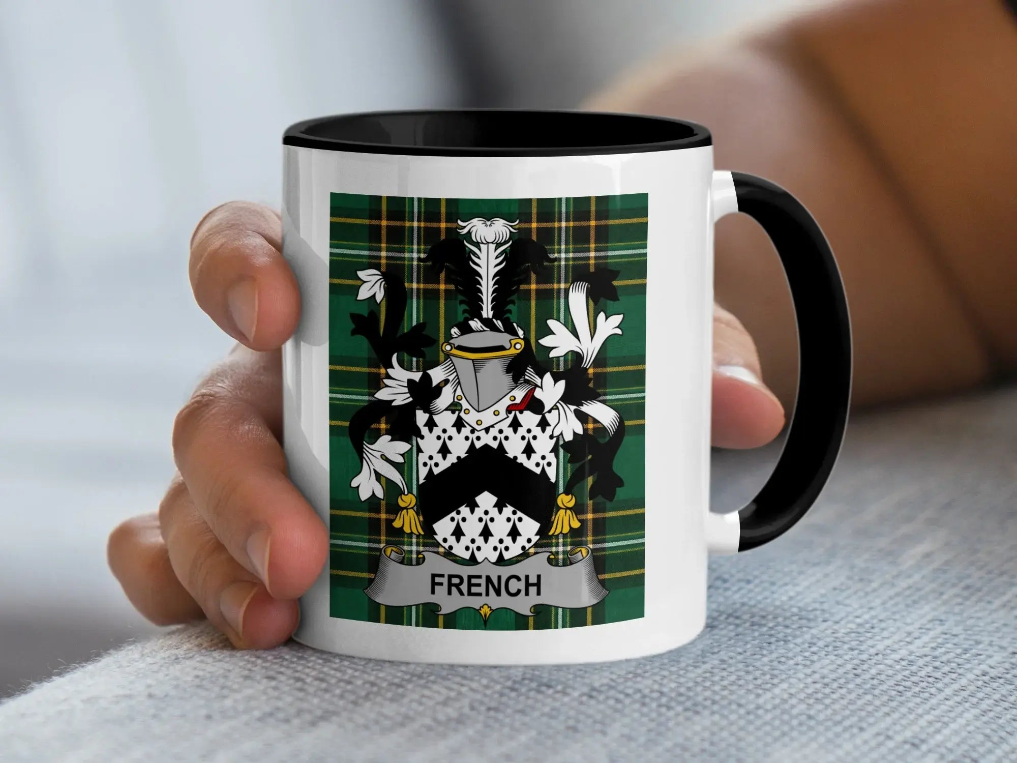 White mug with black rim featuring a green plaid background and French coat of arms.