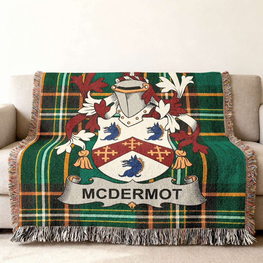 McDermot family crest on green plaid woven throw blanket.
