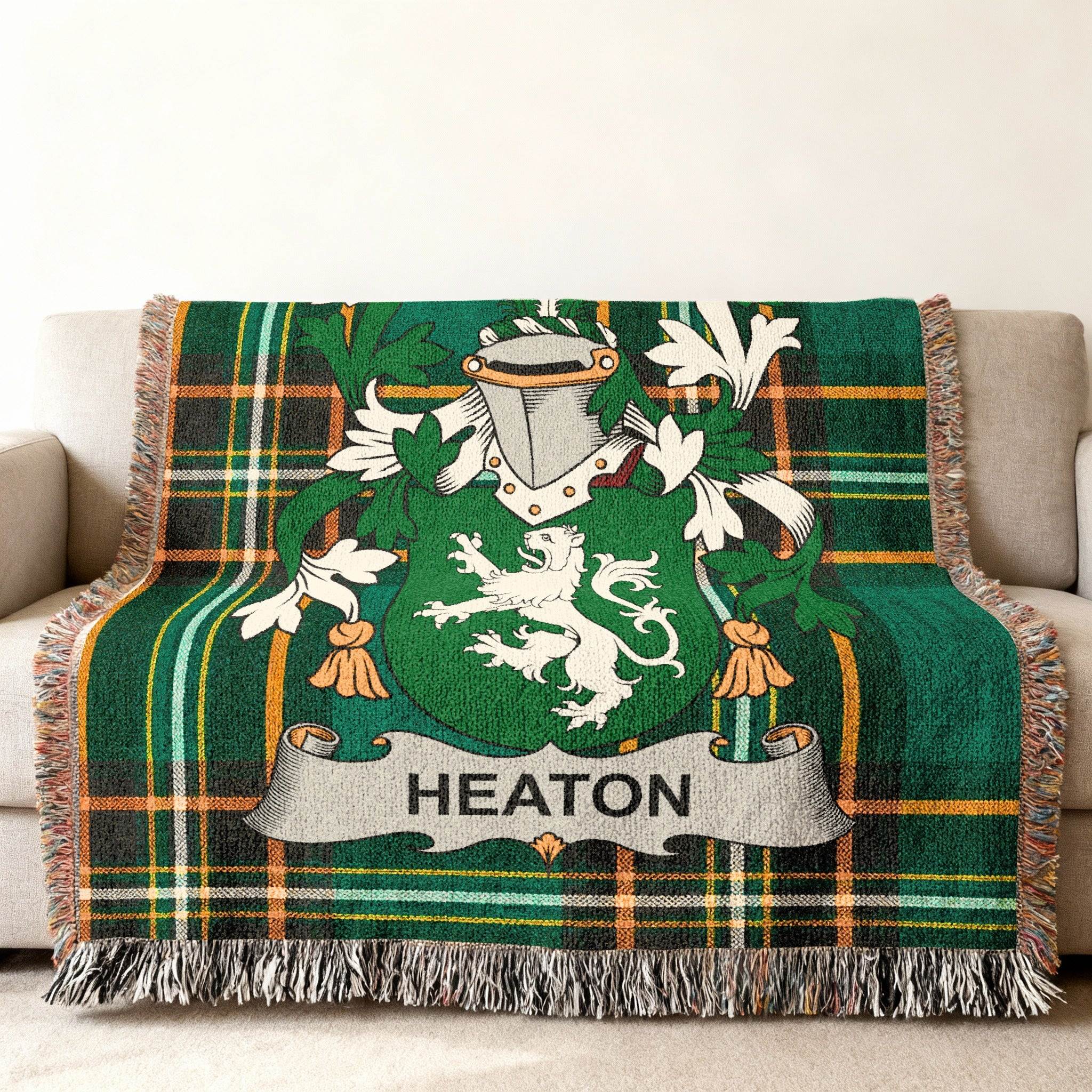 Green plaid throw blanket with Heaton family crest.
