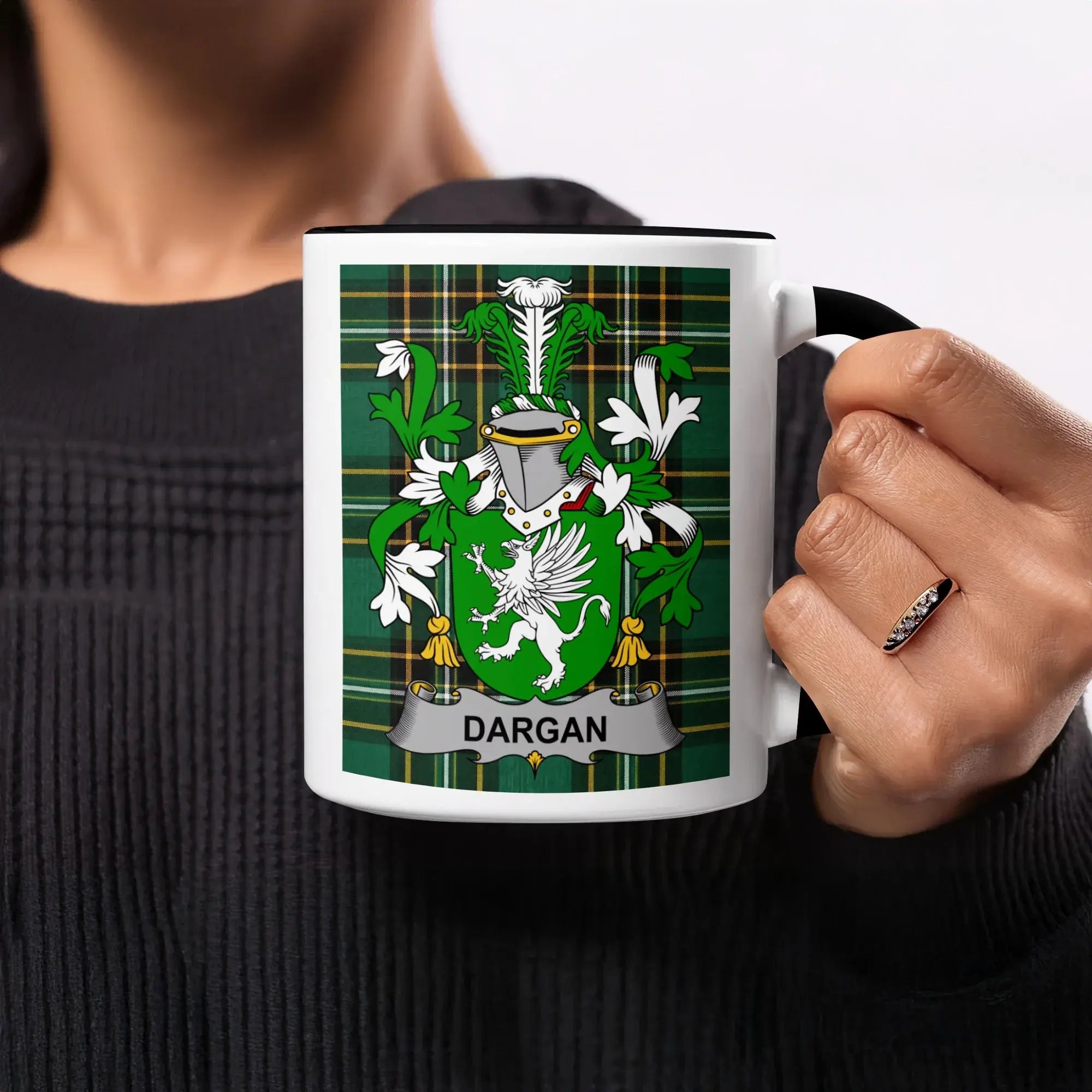 Dargan crest on a white mug with black rim and handle.