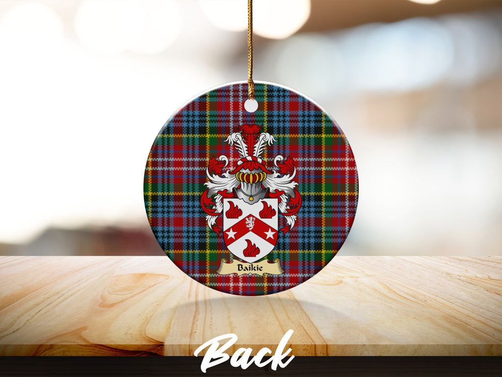 Round Baikie Scottish clan ornament with family crest on a Caledonia tartan background