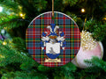 Lithgow Scottish clan ceramic ornament with family crest on a Caledonia tartan background, hanging on a Christmas tree