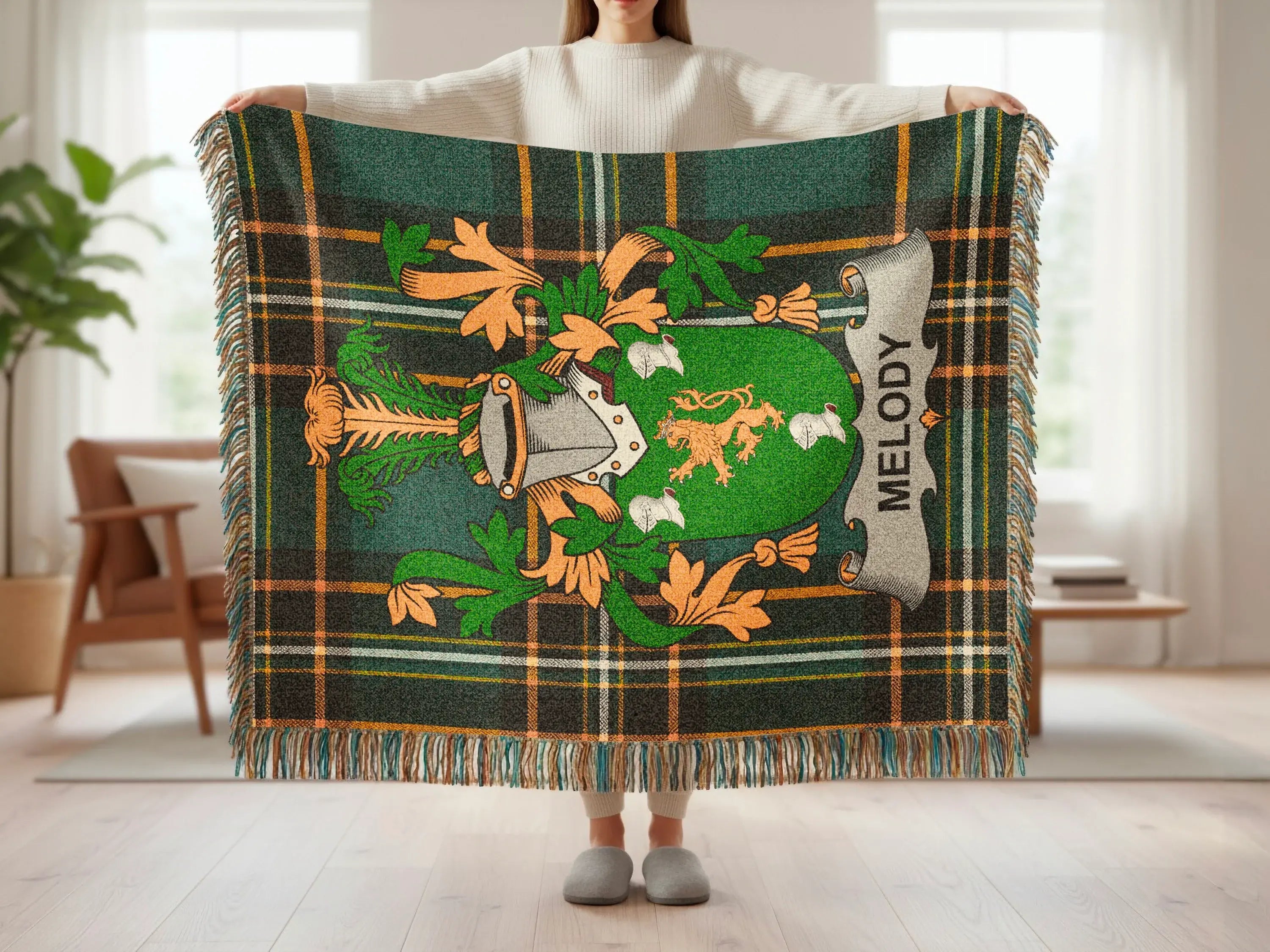 Tartan blanket with family crest and "Melody" text.