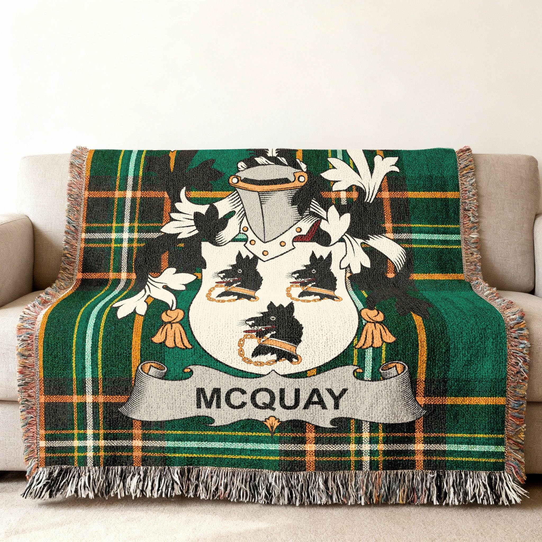 Green and black plaid throw blanket featuring the McQuay family crest.