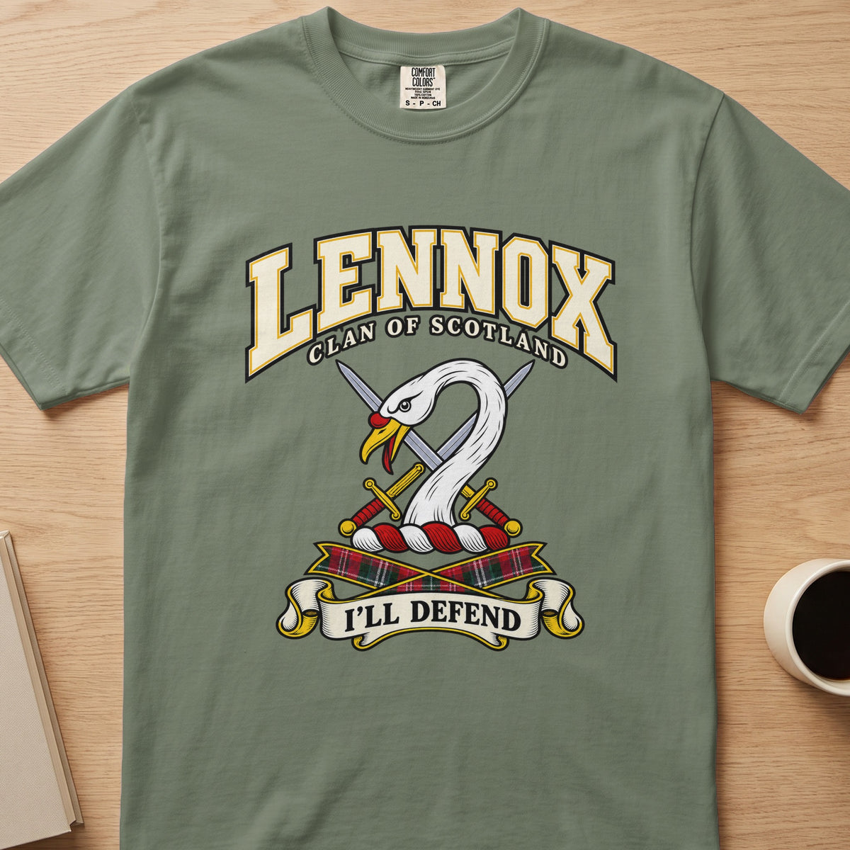 Lennox white swan crest with gold detail graphic on a sage green Comfort Colors T-shirt, front view