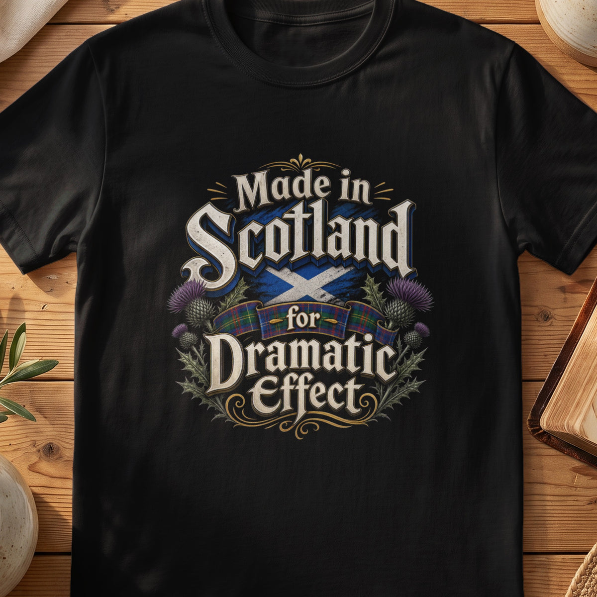 Black Gildan 64000 unisex T-shirt flatlay with Made in Scotland for Dramatic Effect Thistle Scottish graphic design