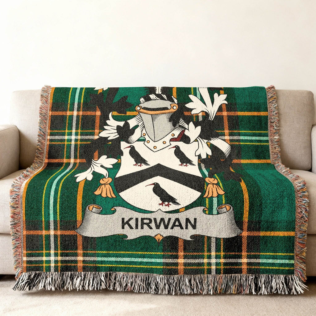 Kirwan family crest on a green tartan throw blanket.