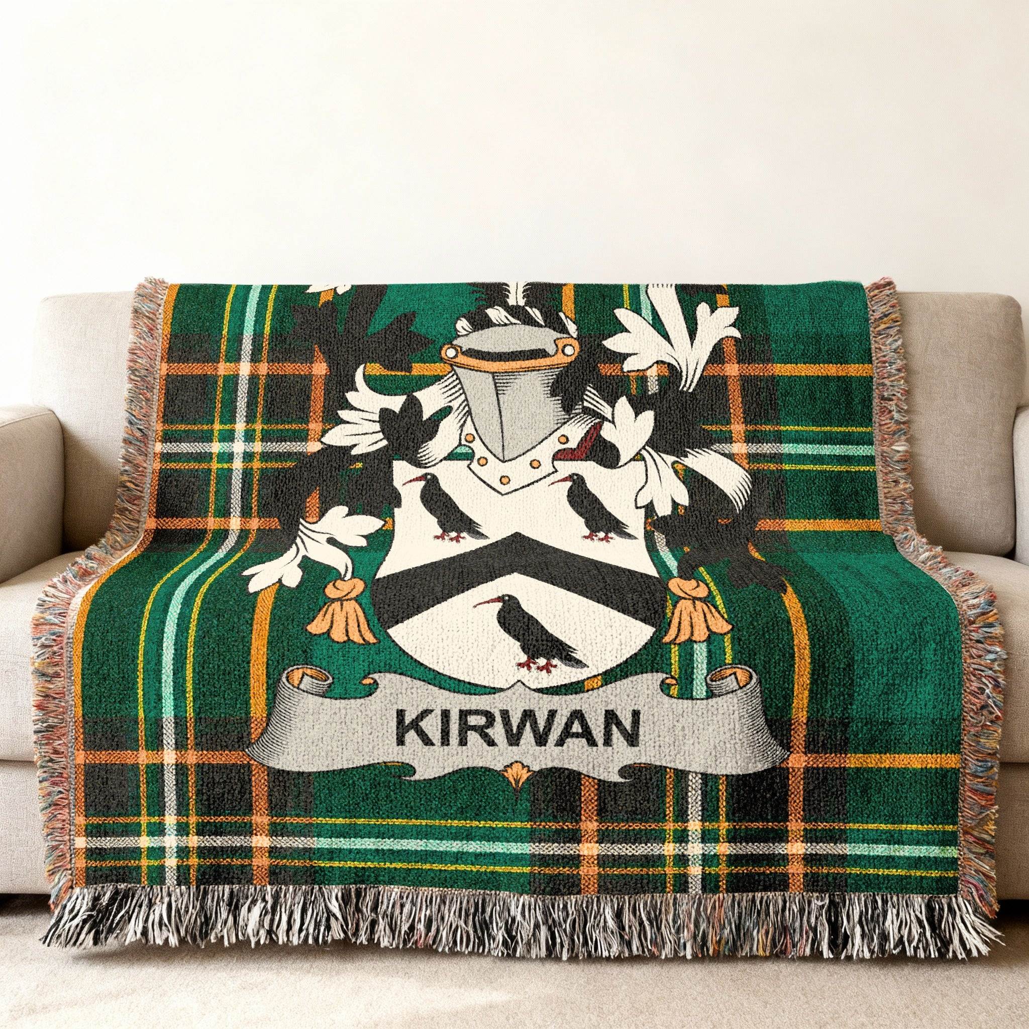 Kirwan family crest on a green tartan throw blanket.