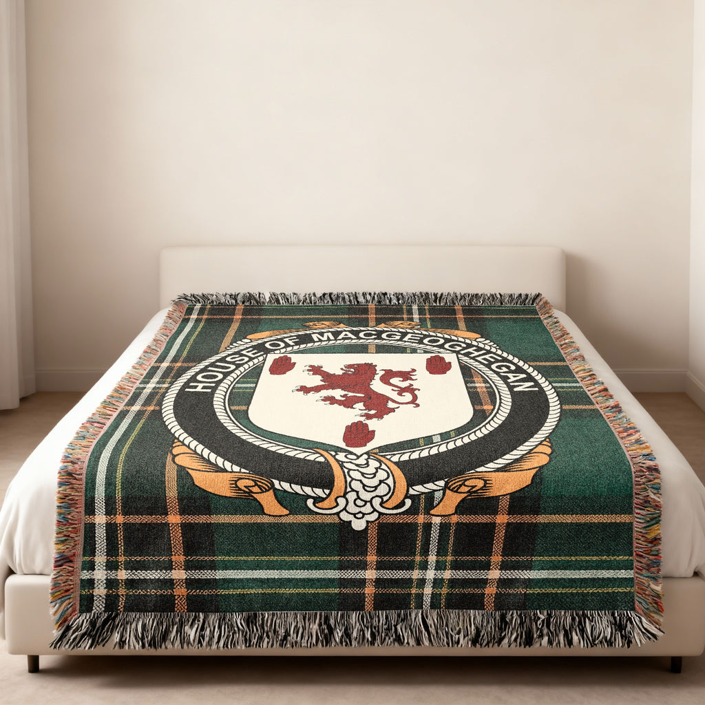 Maceoghegan family crest emblem woven blanket displayed on a bed