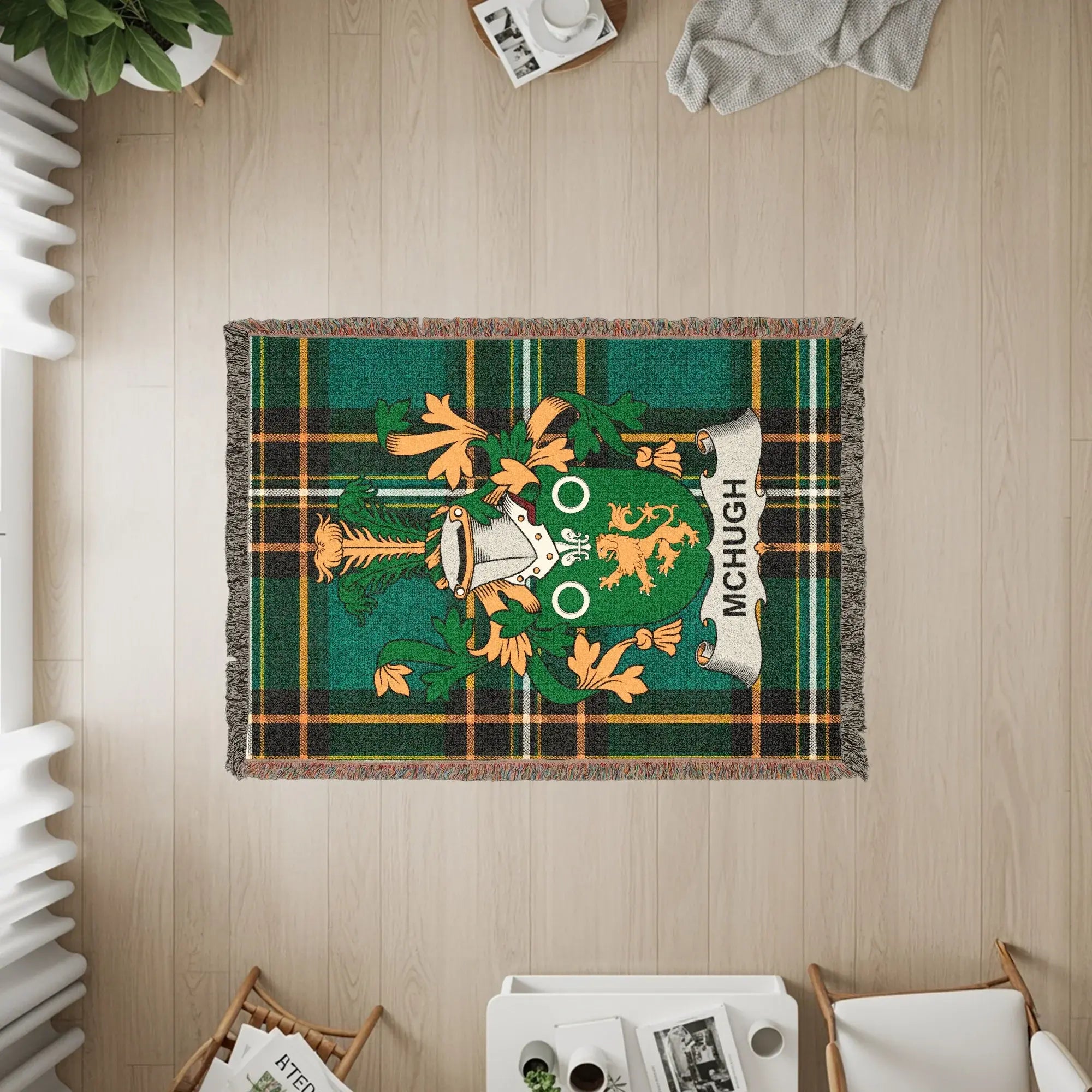 Green tartan throw blanket with McHugh family crest.