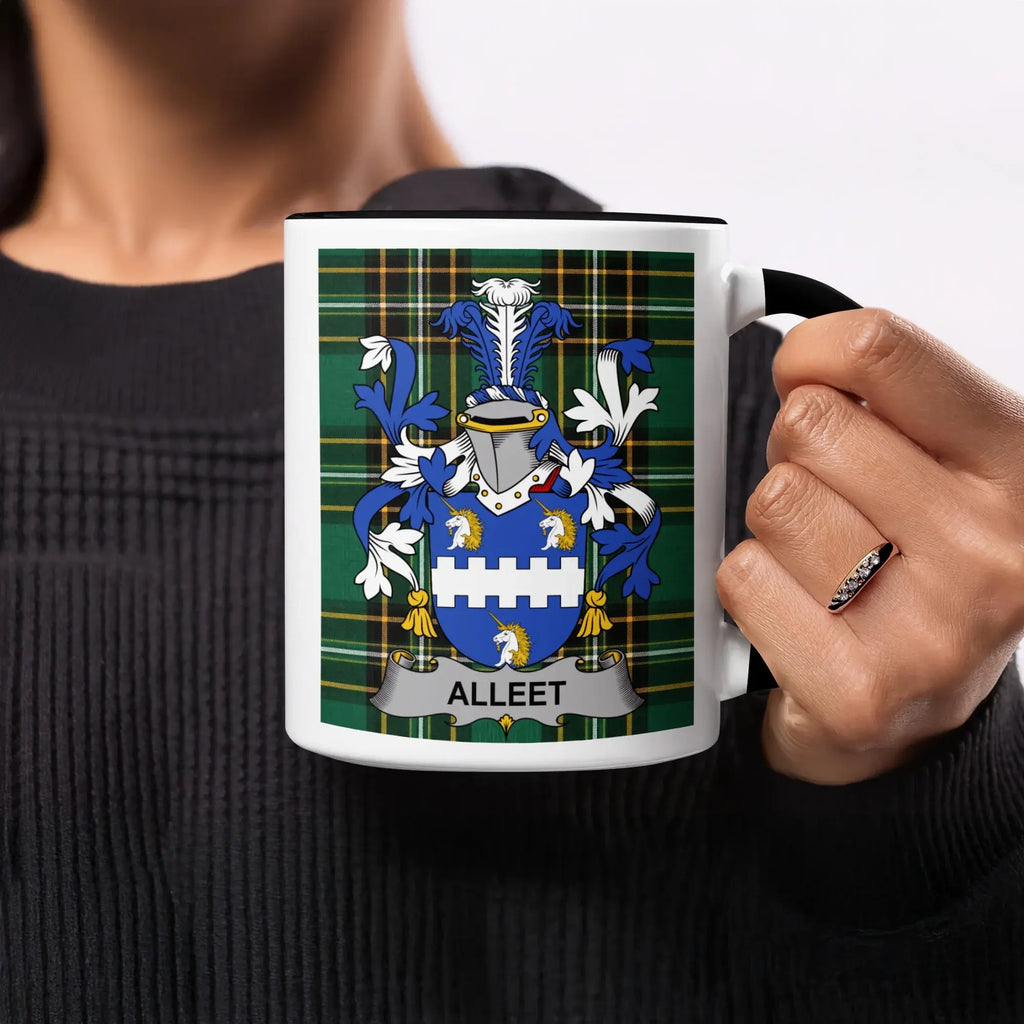 Mug with the Alleen family crest on a green and blue plaid background.