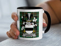 White mug with black rim featuring a green plaid crest with the name "Kighley".
