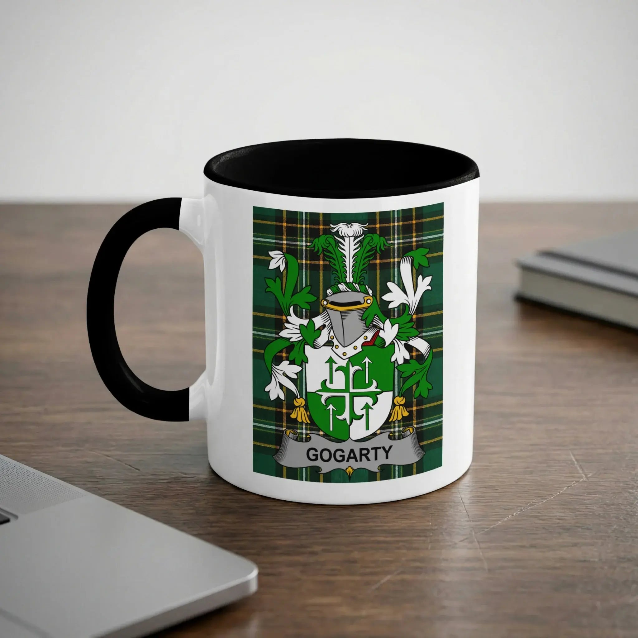 White mug with black handle featuring the GOGARTY family crest on a plaid background.