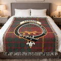 Cameron clan tartan woven blanket on sofa — 100% cotton with red plaid and clan crest
