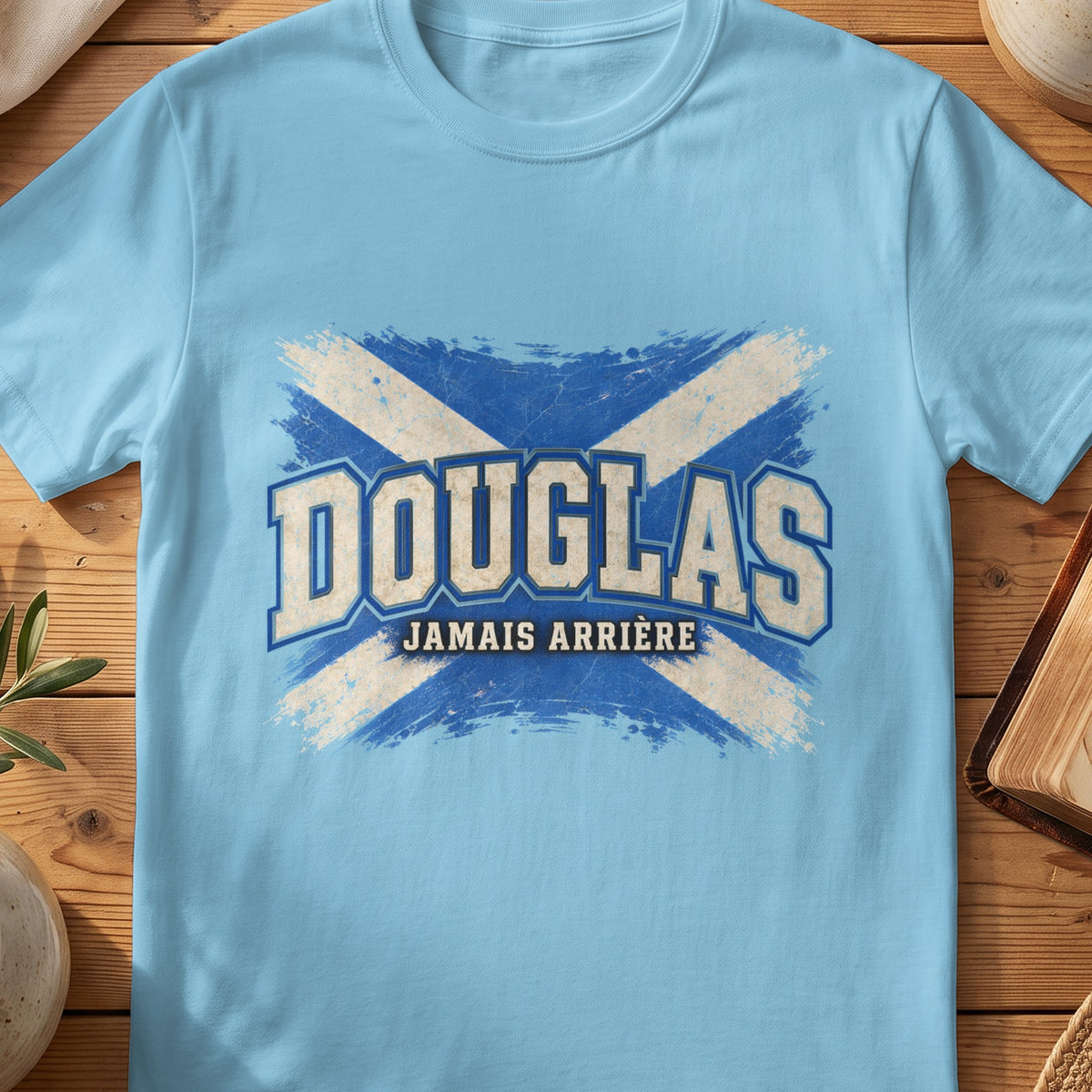 Douglas Scottish Saltire T-shirt in Sky, with distressed blue and cream flag and “Jamais Arrière” lettering.