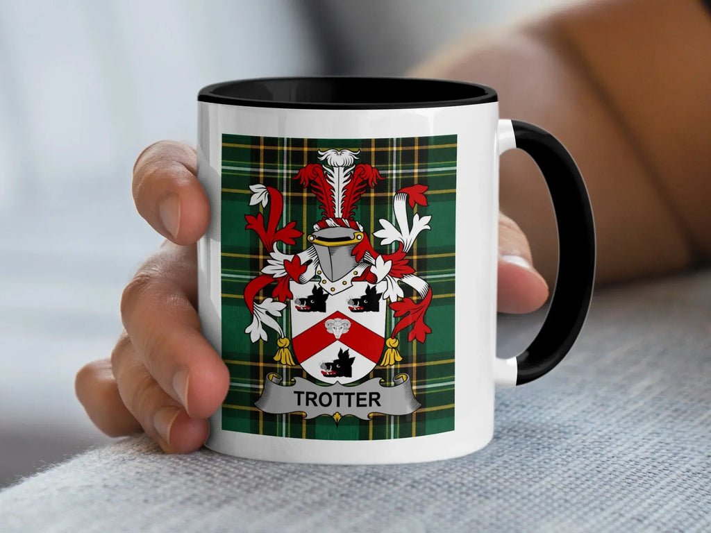 White mug with black handle featuring the Trotter family crest on a tartan background.