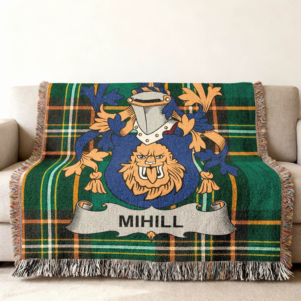Green plaid woven throw blanket with the MIHILL family crest centered.