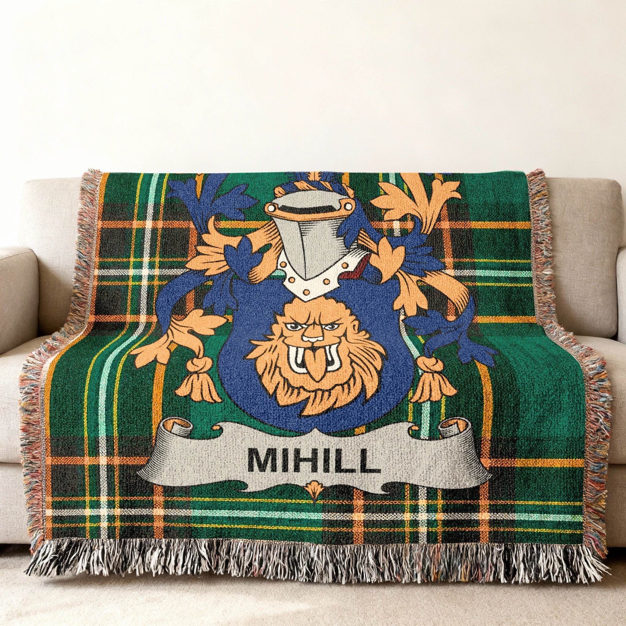 Green plaid woven throw blanket with the MIHILL family crest centered.