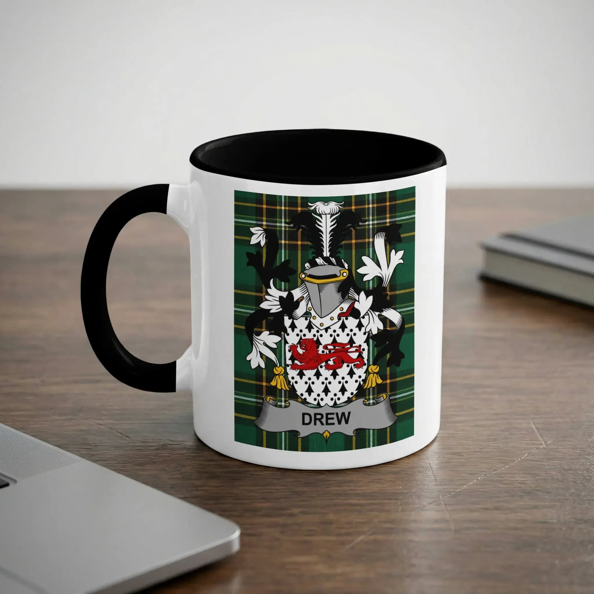 White mug with black handle and rim featuring the Drew family crest and name.