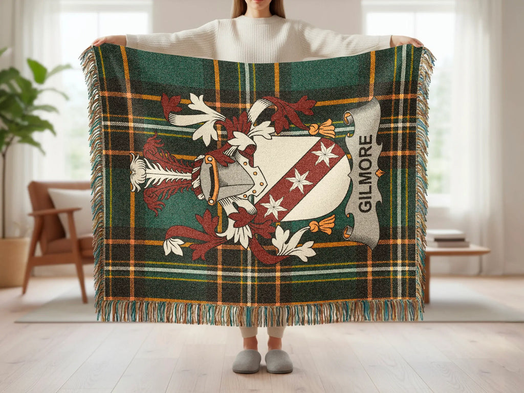 Green tartan throw blanket with Gilmore family crest.