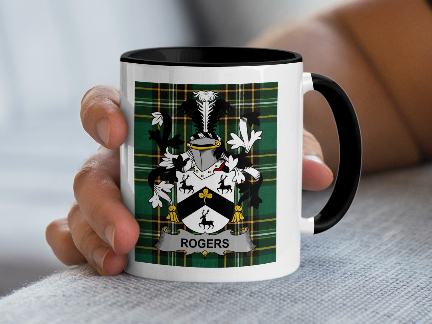 White mug with black handle featuring a green plaid pattern and the "ROGERS" family crest.