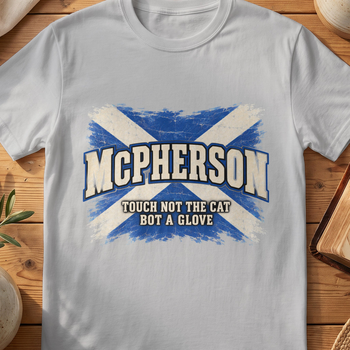 McPherson Scottish Saltire T-shirt in Sport Grey, with distressed blue and cream flag and “Touch Not the Cat Bot a Glove” lettering.