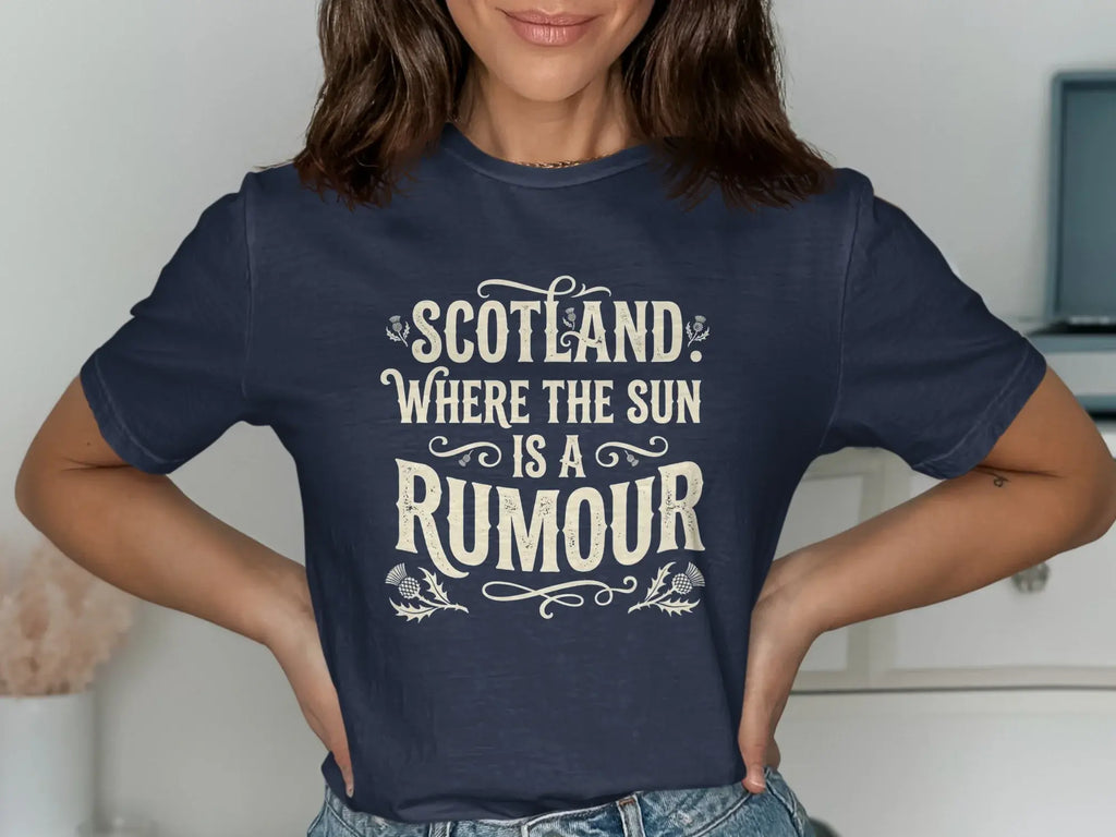 Navy t-shirt with "Scotland: Where the Sun is a Rumour" text and thistle design.