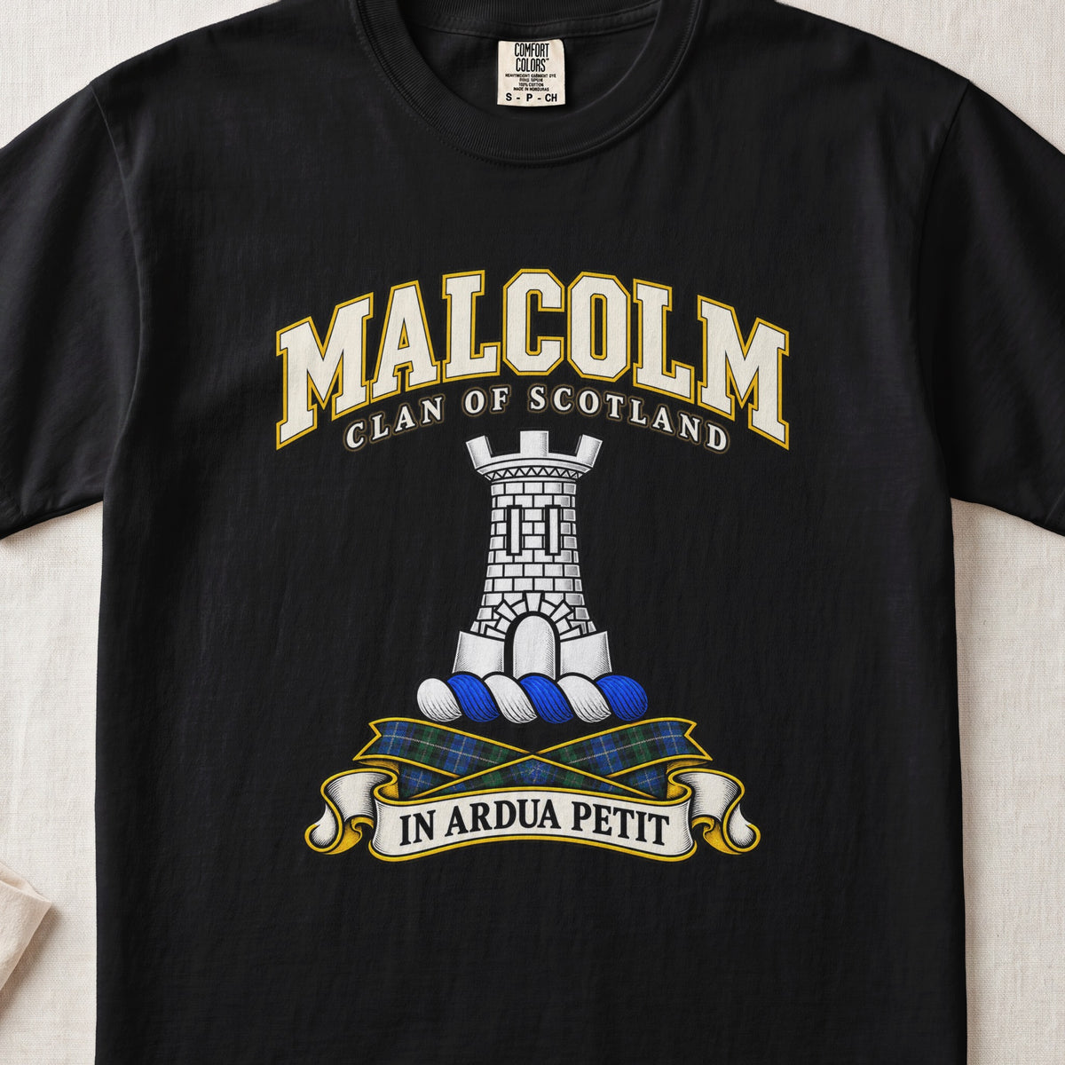 Malcolm Scottish clan T-shirt in Black, front view with a gray stone tower and motto banner.
