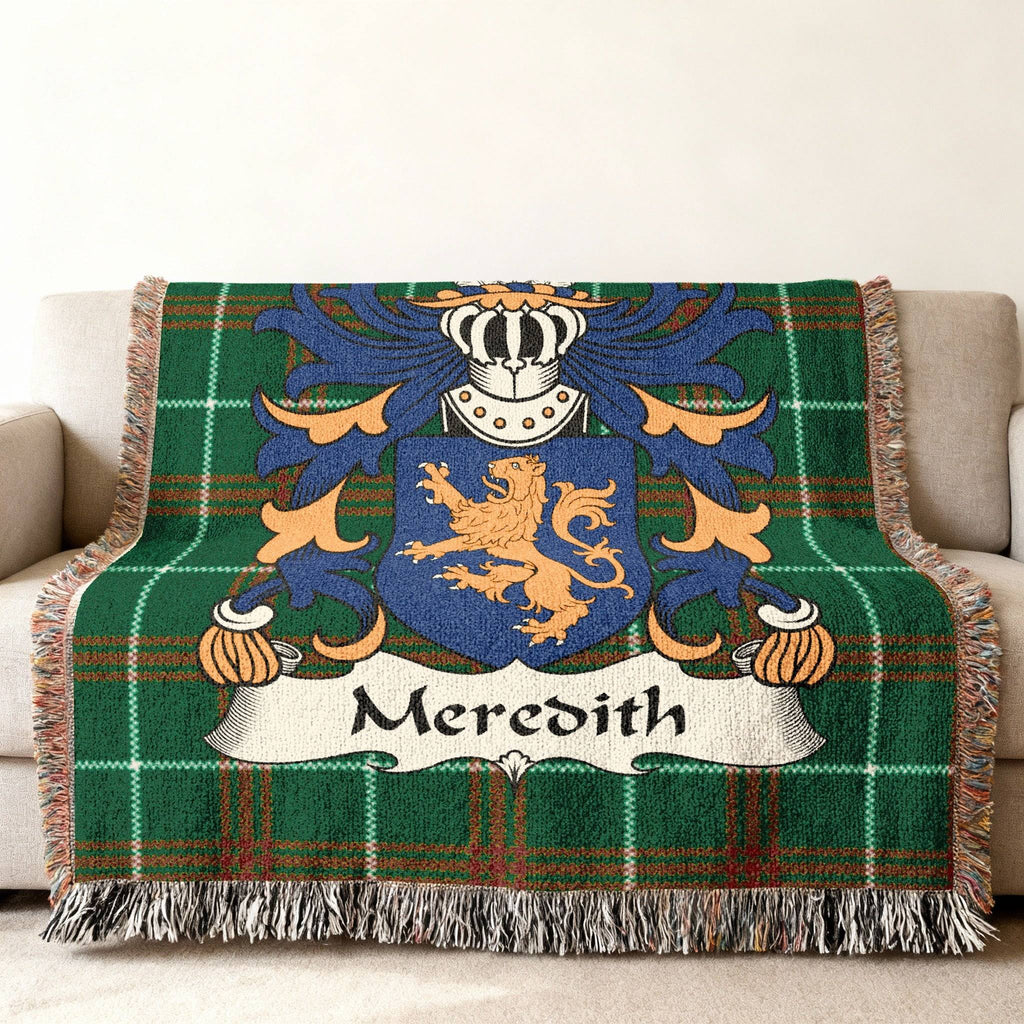 Green tartan throw blanket with Meredith family crest.