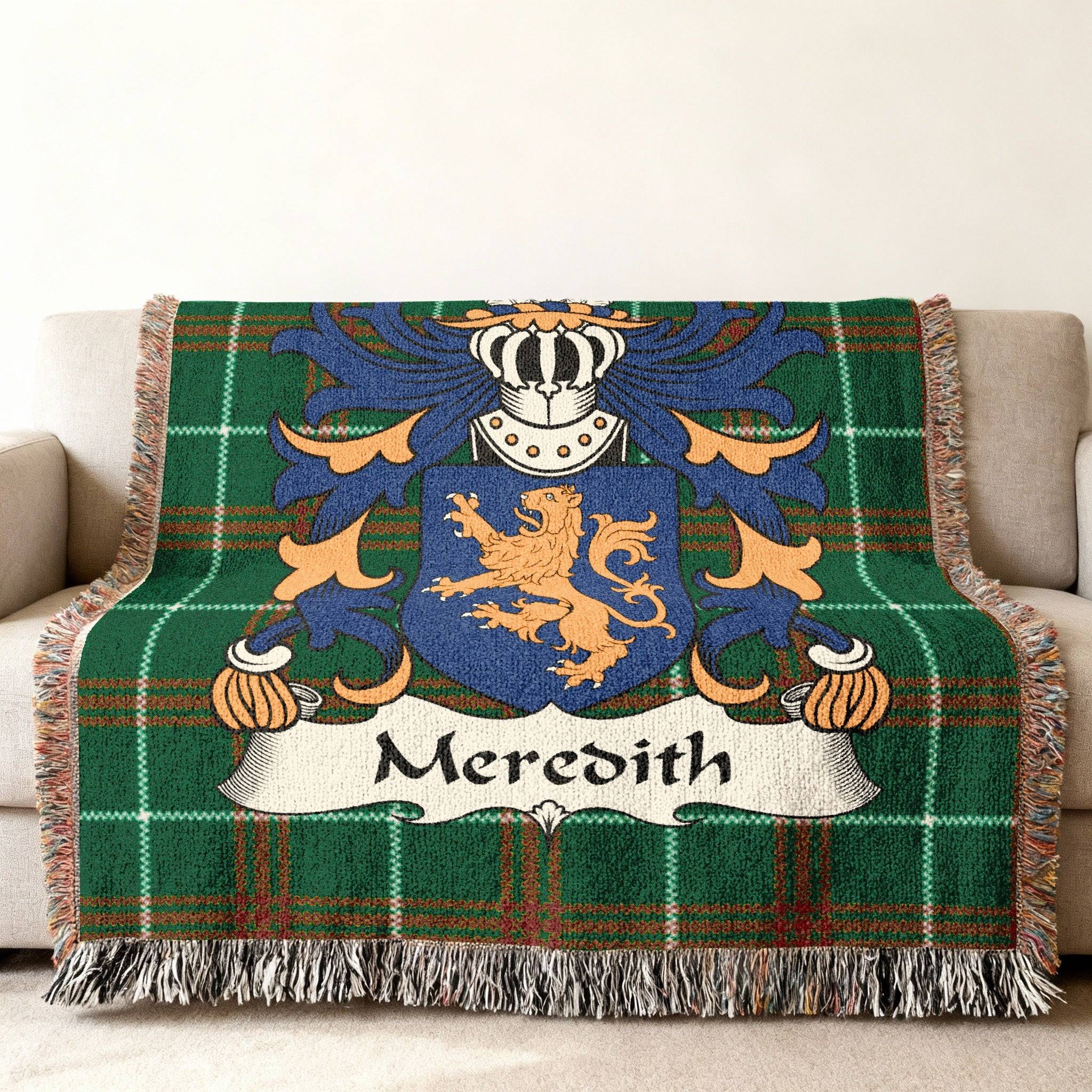 Green tartan throw blanket with Meredith family crest.