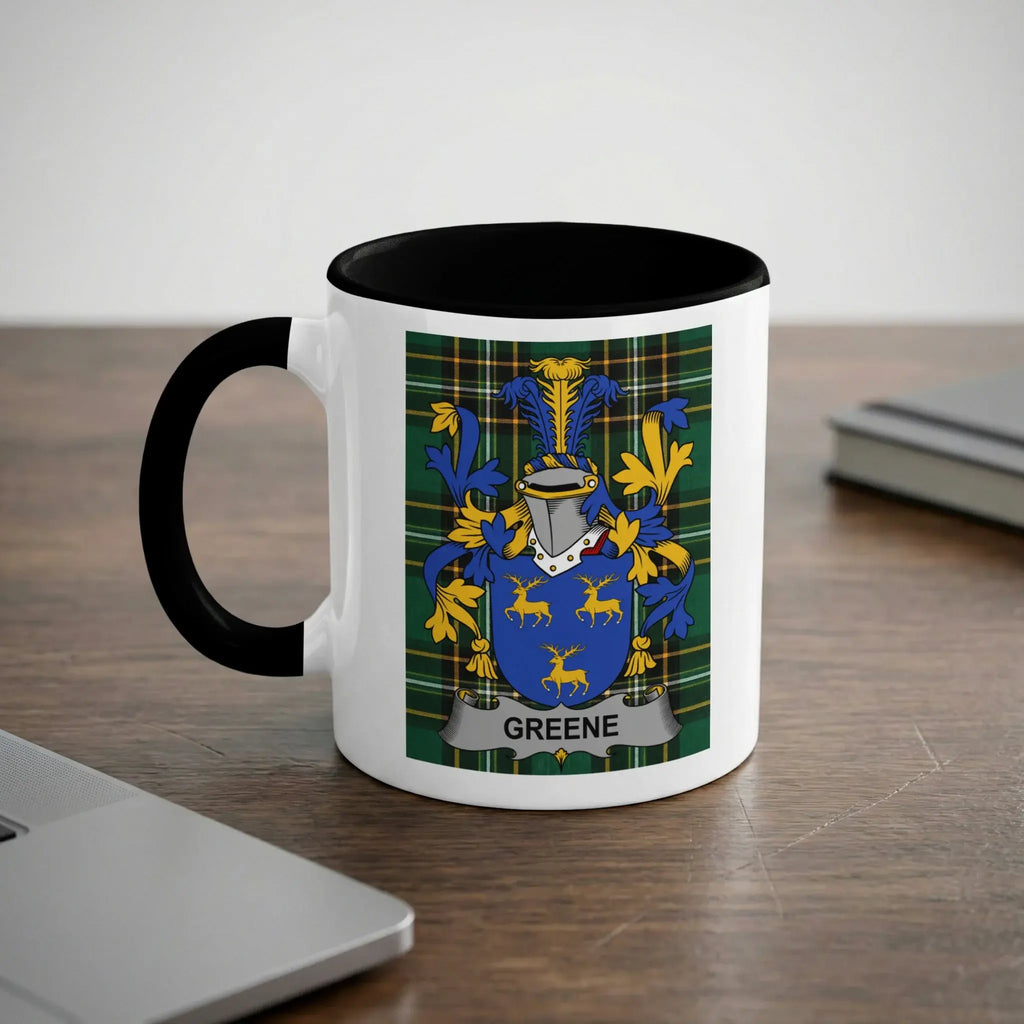 White mug with black rim and handle, displaying the Greene family crest.