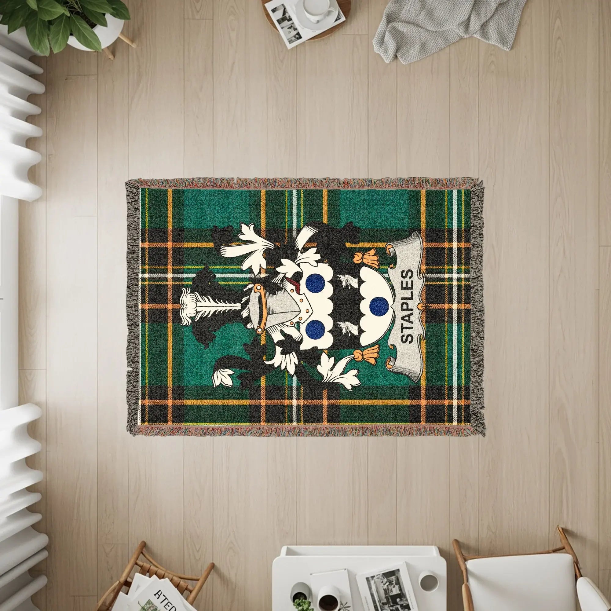 Staples tartan rug with family crest displayed.