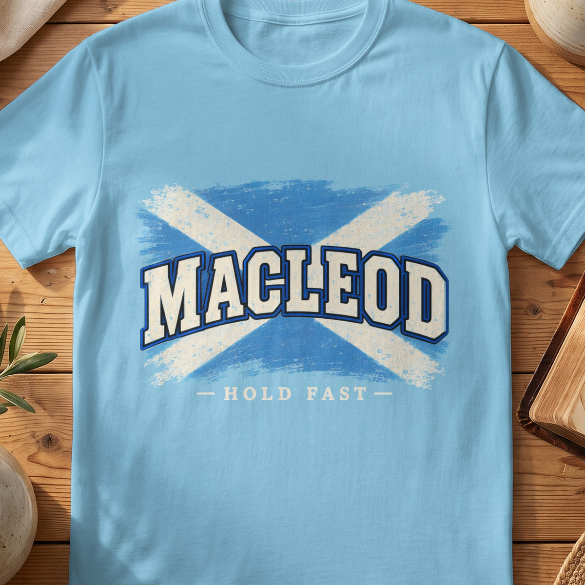 MacLeod Scottish Saltire T-shirt in Sky, with distressed blue and cream flag and “Hold Fast” lettering.