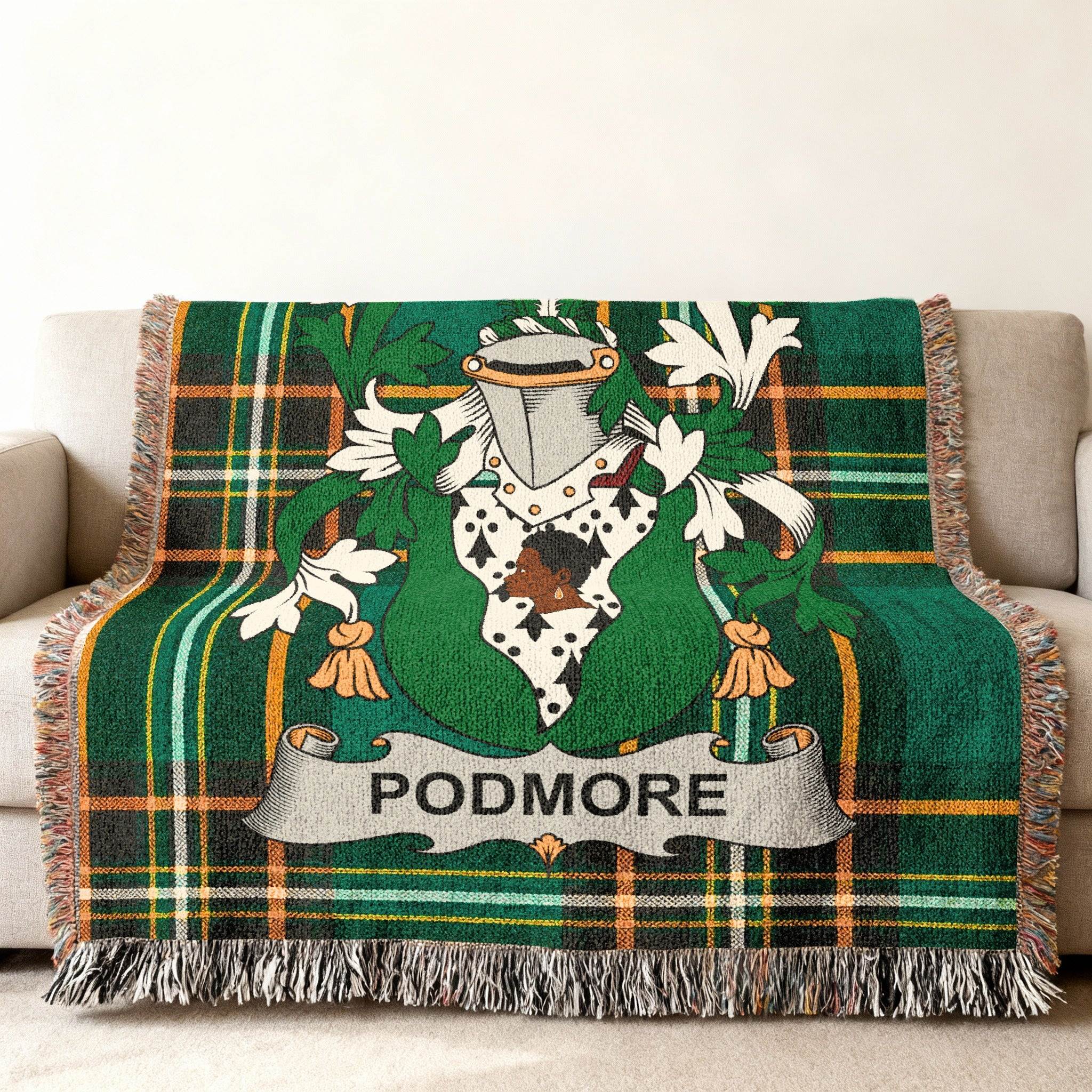 Green tartan blanket with a coat of arms and "PODMORE" text.