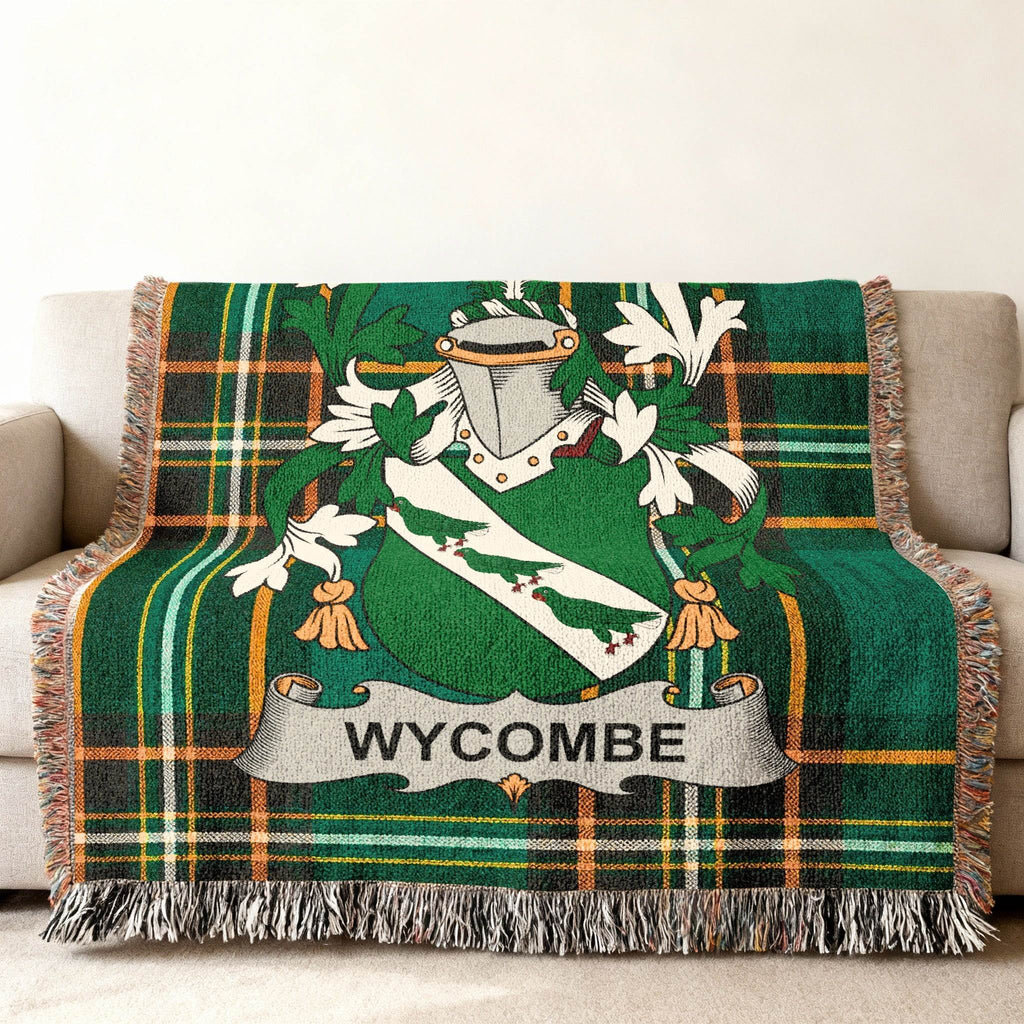 Green plaid throw blanket featuring the Wycombe family crest.