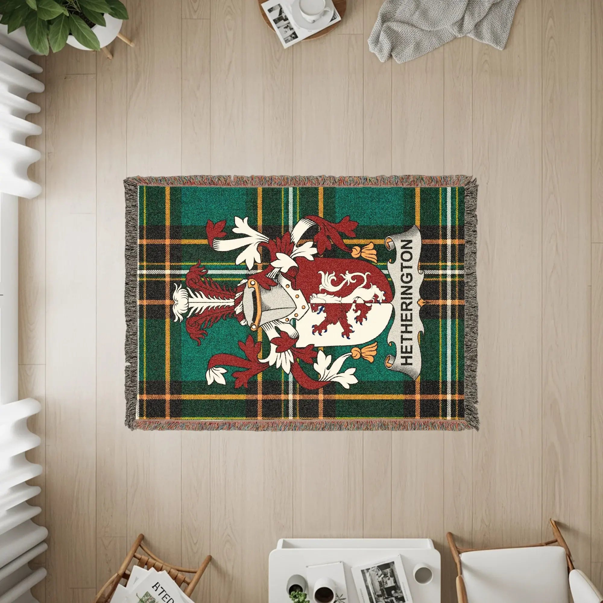 Hetherington family crest on a green tartan woven throw blanket.