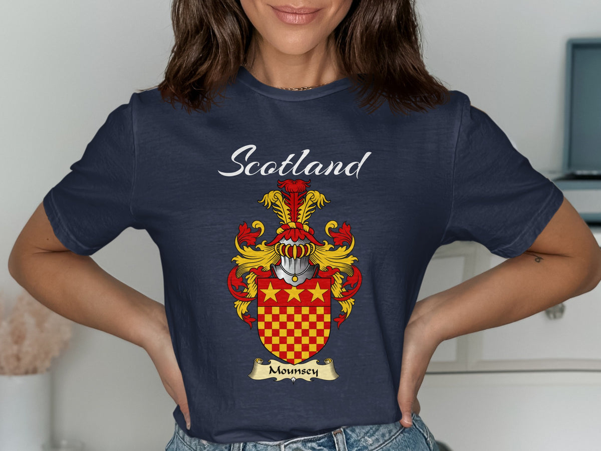 Model wearing a navy Mounsey T-shirt featuring red-and-gold checks beneath three gold stars